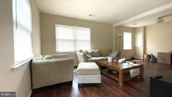a living room with furniture and windows