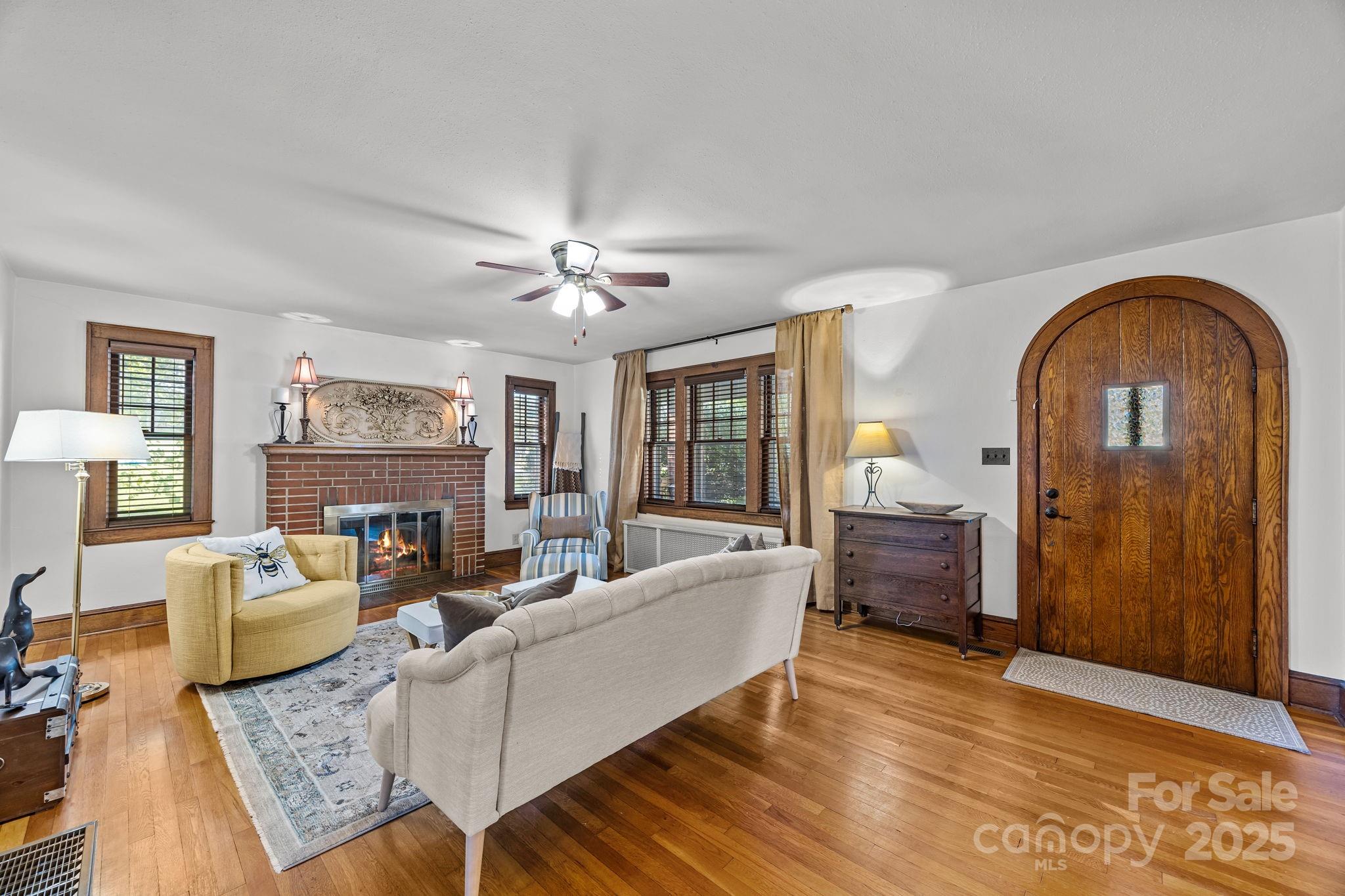 495 Fairview Road Asheville, NC 28803 - Photo 12 of 41 a living room with furniture and wooden floor