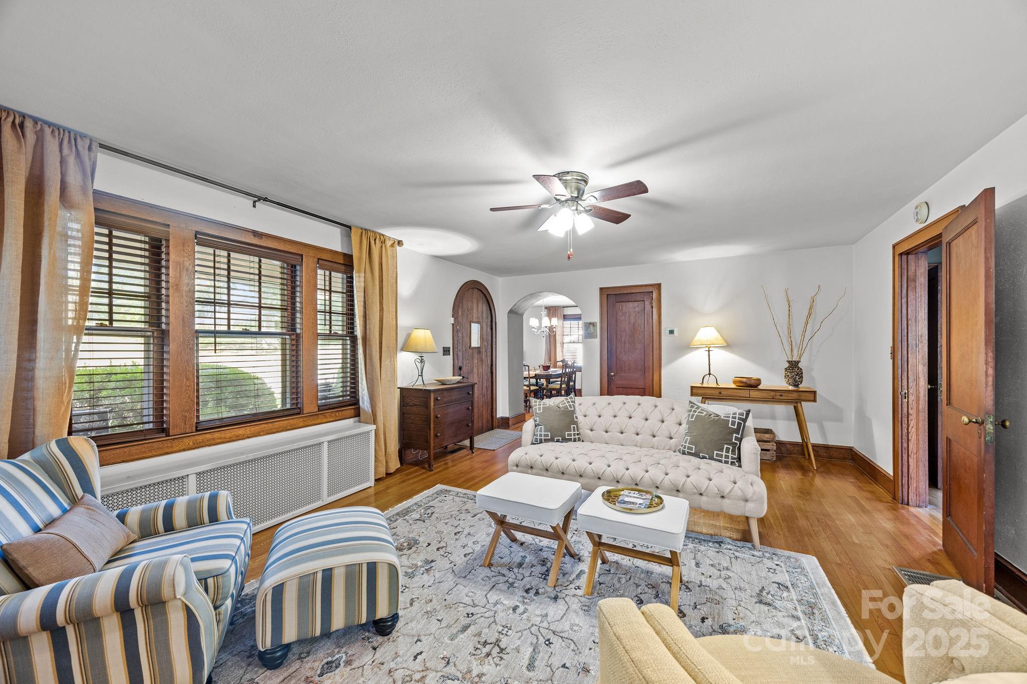 495 Fairview Road Asheville, NC 28803 - Photo 14 of 41 a living room with furniture and two large window