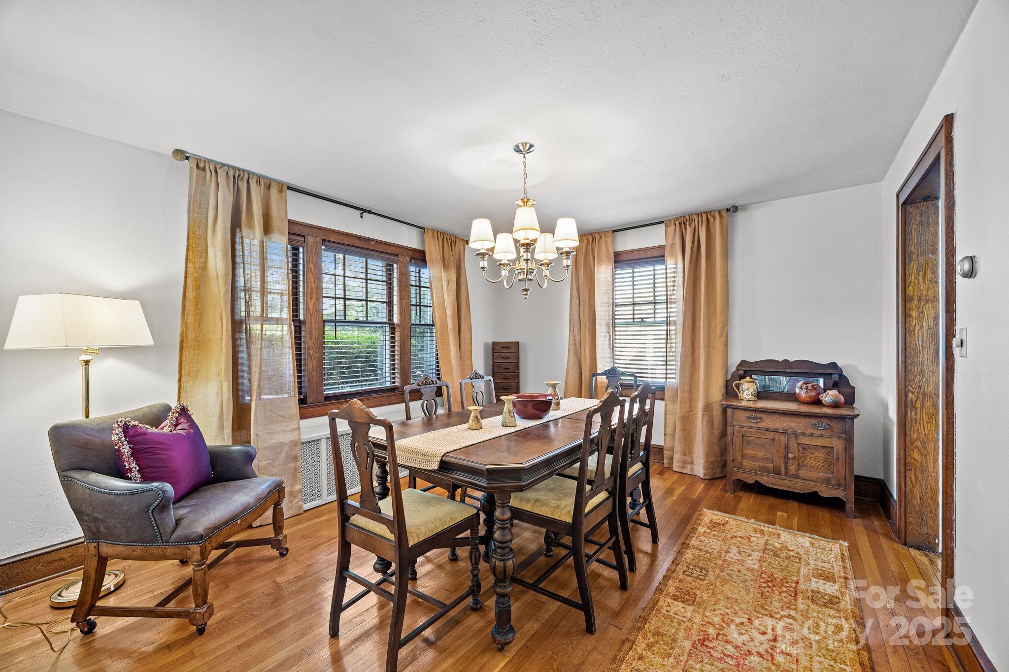 495 Fairview Road Asheville, NC 28803 - Photo 16 of 41 a view of a dining room with furniture window and outside view