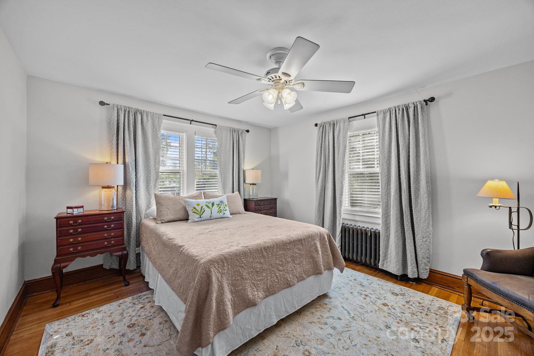 495 Fairview Road Asheville, NC 28803 - Photo 21 of 41 a bedroom with a bed dresser and a window
