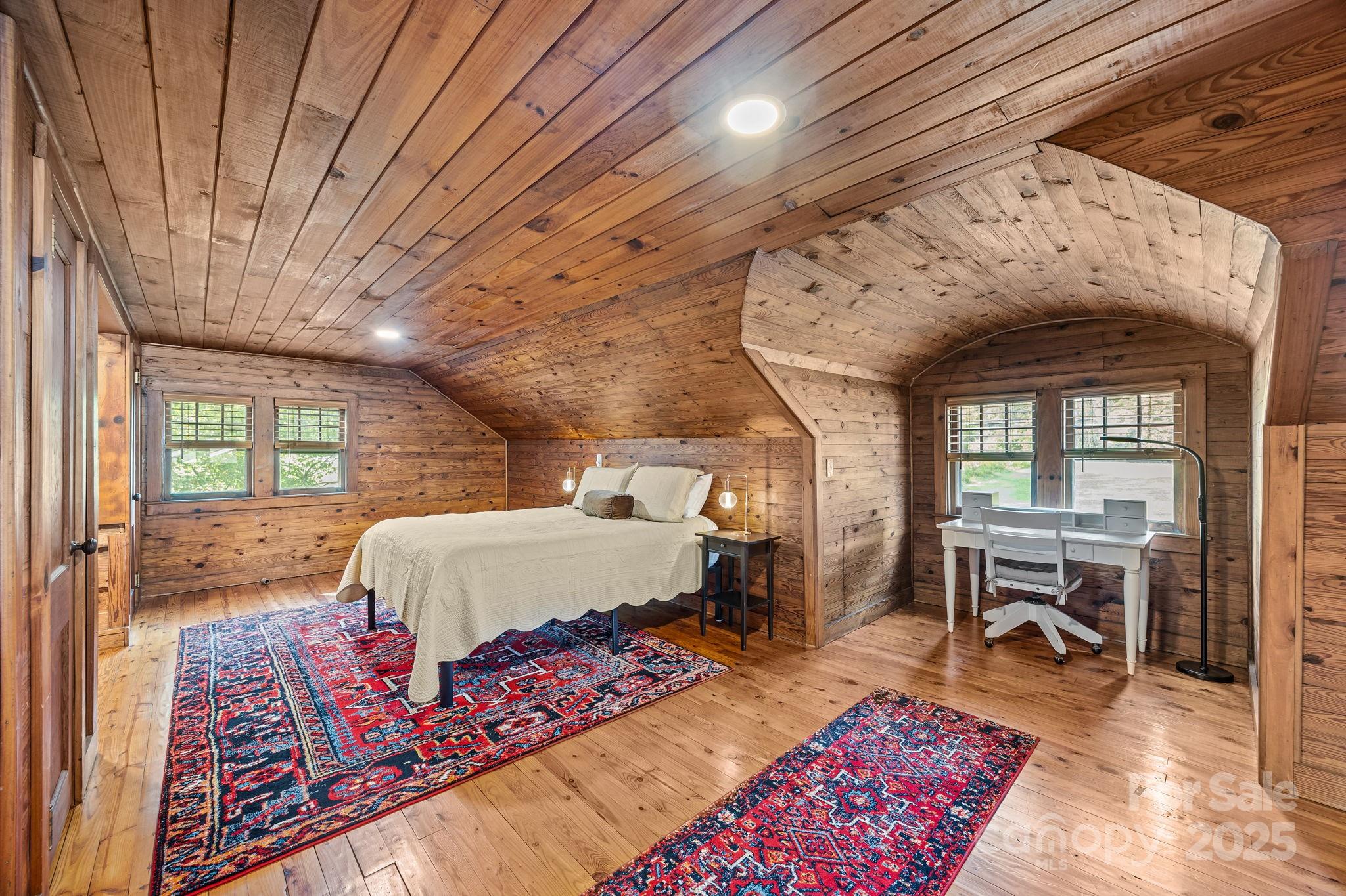 495 Fairview Road Asheville, NC 28803 - Photo 27 of 41 a living room with furniture and a wooden floor