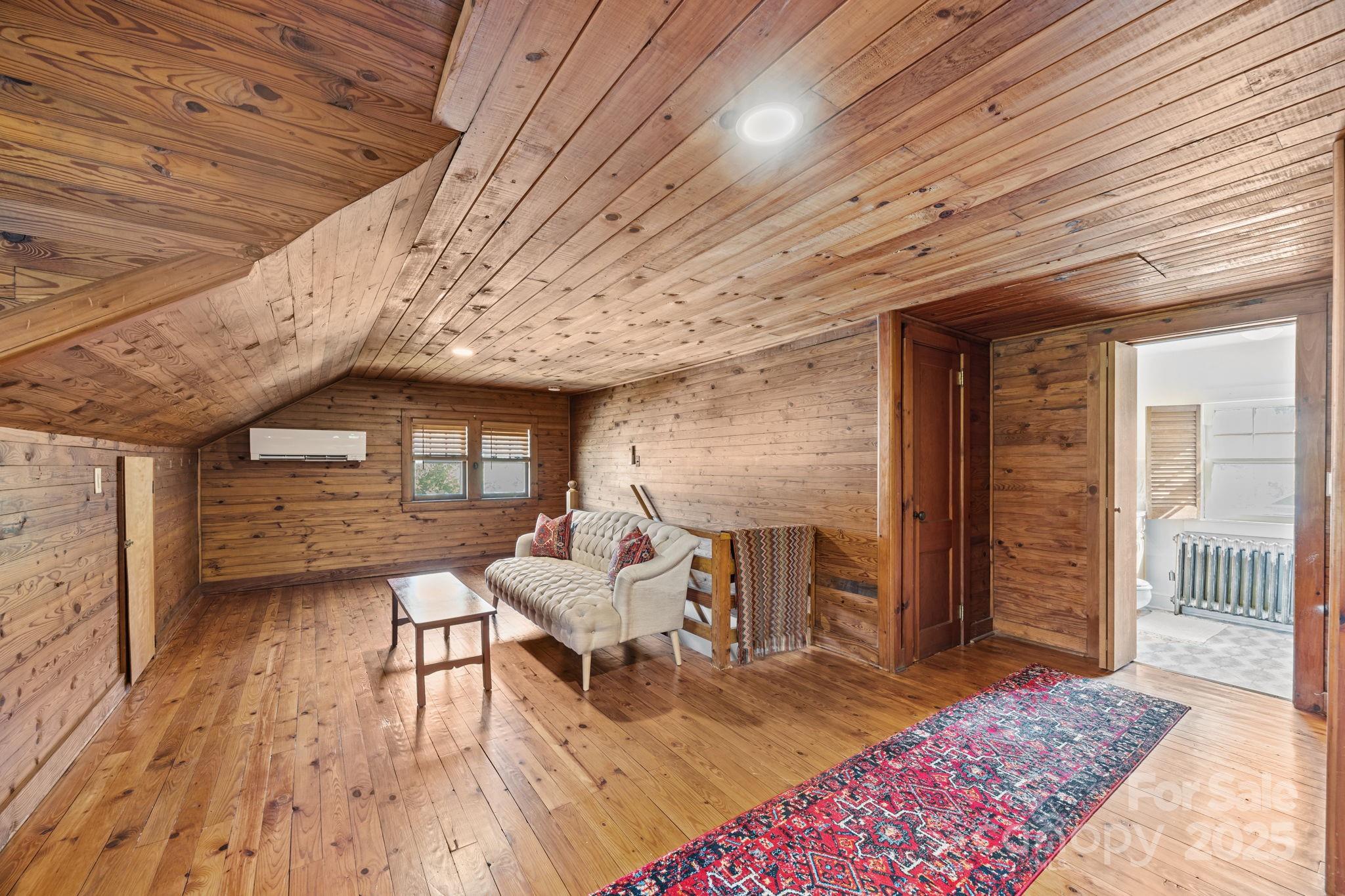 495 Fairview Road Asheville, NC 28803 - Photo 28 of 41 a outdoor space with lots of furniture and wooden floor