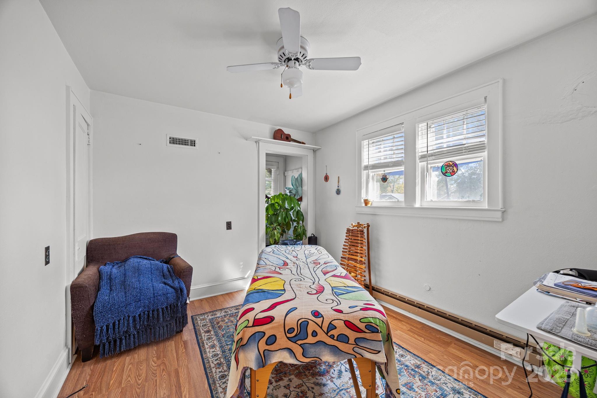 495 Fairview Road Asheville, NC 28803 - Photo 36 of 41 a bedroom with two beds and a window