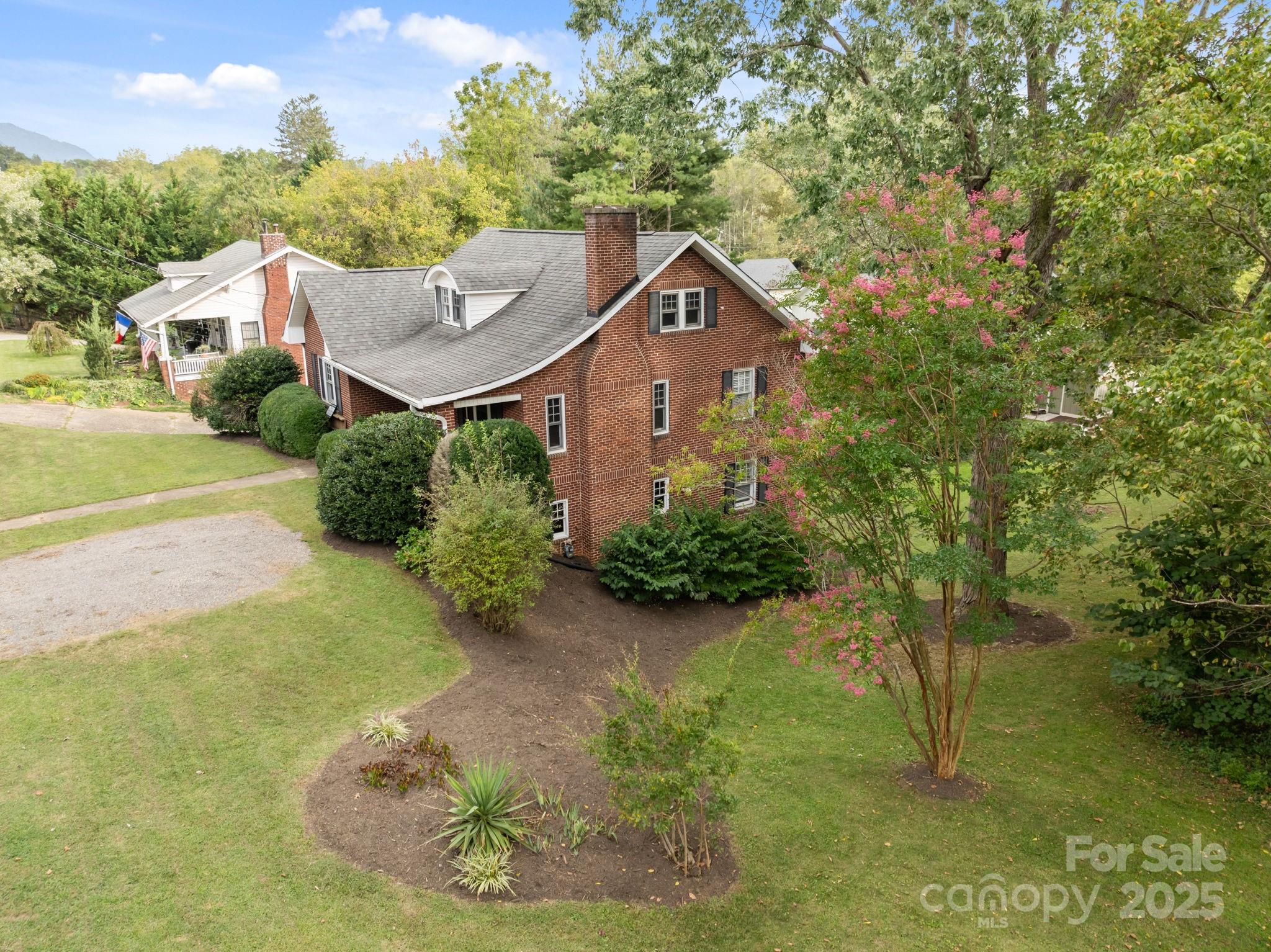 495 Fairview Road Asheville, NC 28803 - Photo 4 of 41 a aerial view of a house with garden