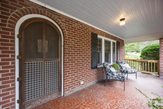 a view of a door with a bench