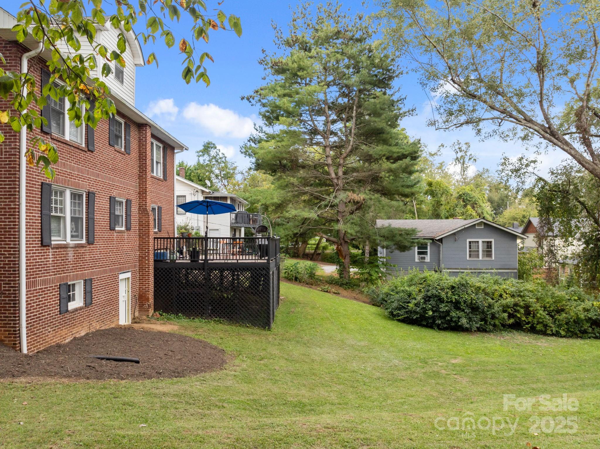 495 Fairview Road Asheville, NC 28803 - Photo 10 of 41 a house view with a garden space