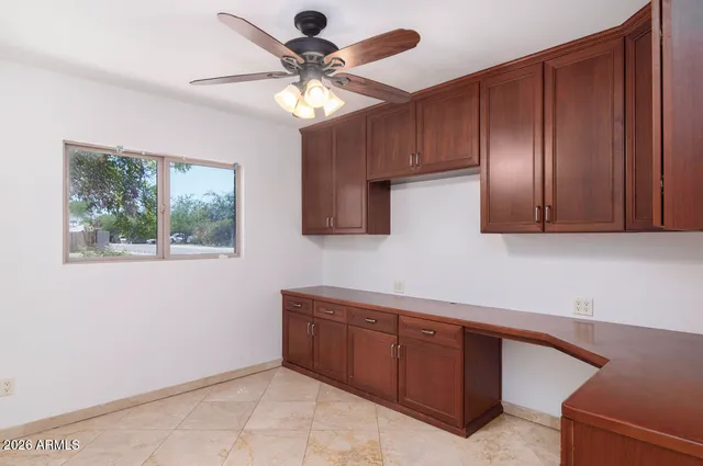 a kitchen with stainless steel appliances granite countertop cabinets and window