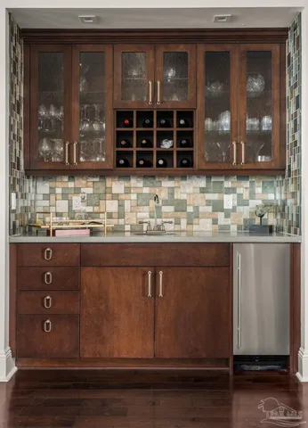 a kitchen with wooden cabinets and a granite counter top
