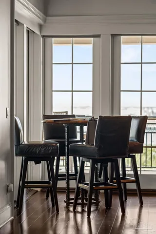 a view of a dining room with furniture and a window