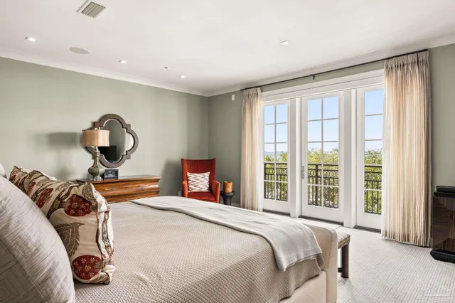 a bedroom with a bed and a table