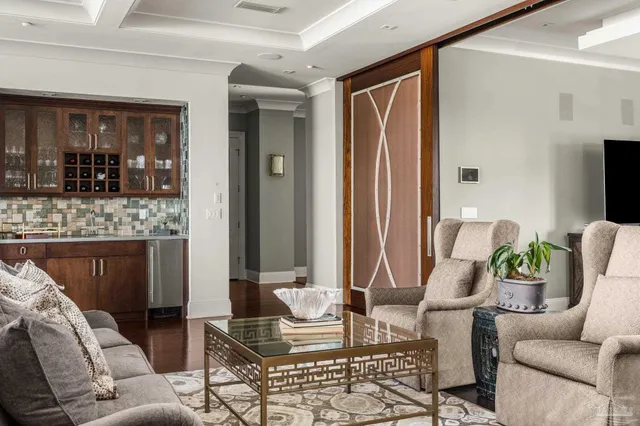 a living room with furniture and dining area