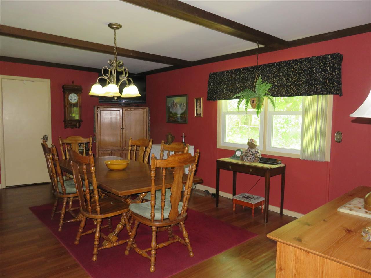 8766 Lovesee Road Roscoe, IL 61073 - Photo 12 of 27 a view of a dining room with furniture window and wooden floor