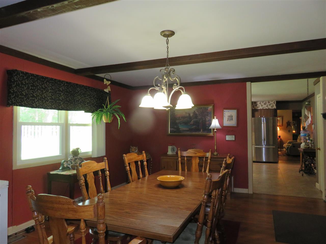 8766 Lovesee Road Roscoe, IL 61073 - Photo 13 of 27 a view of a dining room with furniture window and outside view