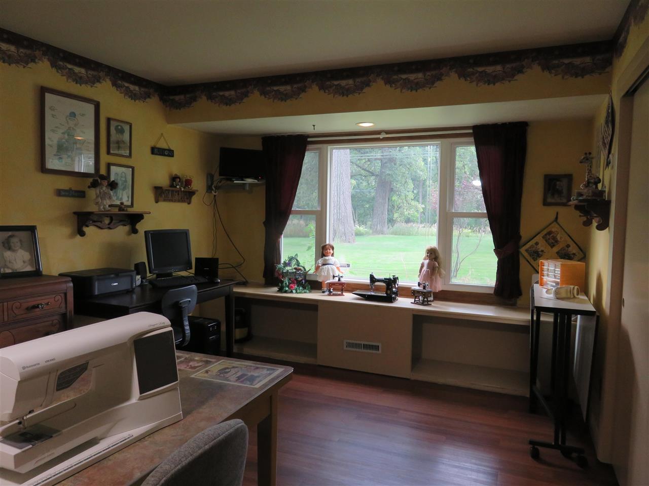 8766 Lovesee Road Roscoe, IL 61073 - Photo 21 of 27 a room with furniture and a window