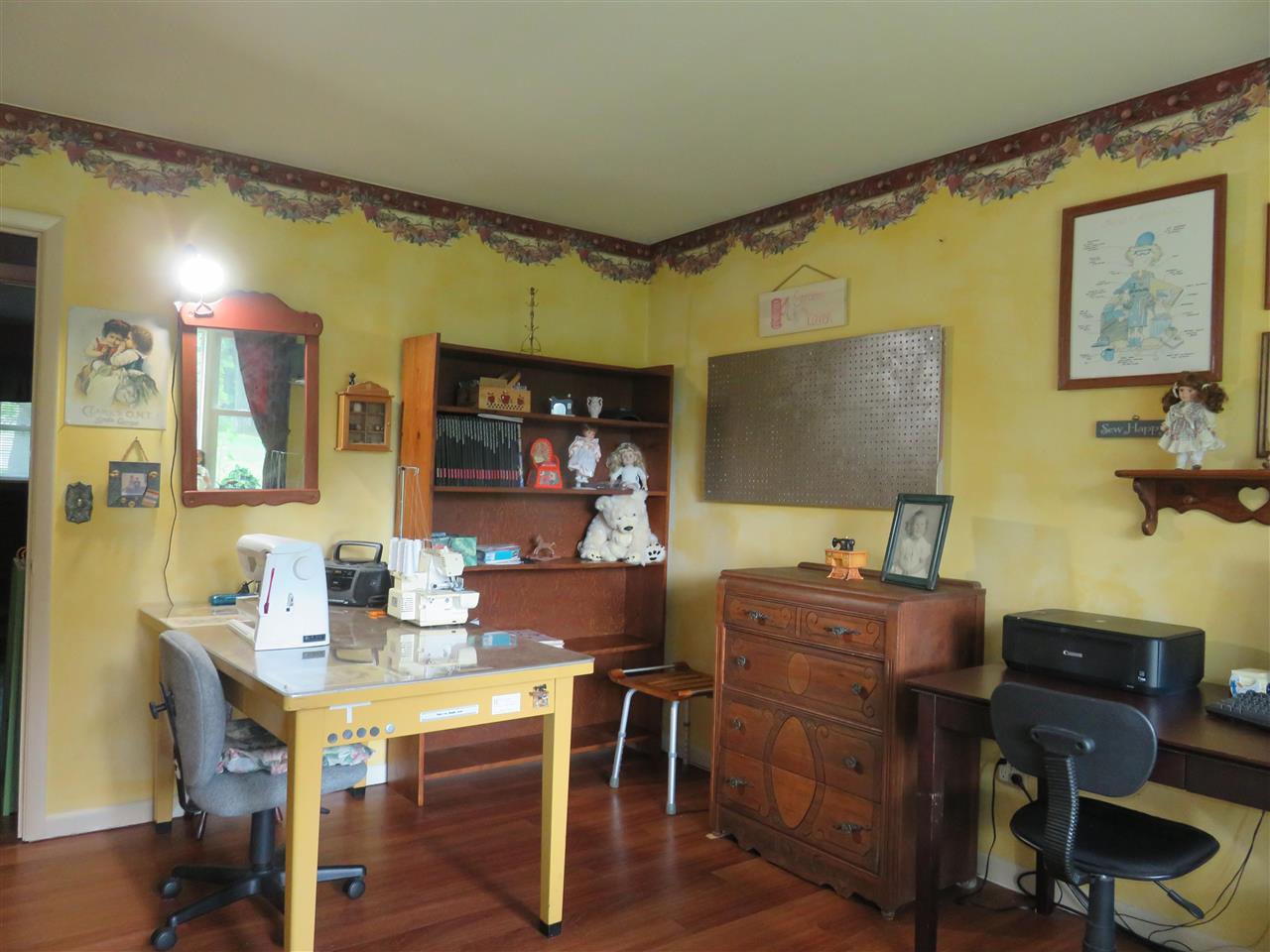 8766 Lovesee Road Roscoe, IL 61073 - Photo 22 of 27 a work room with furniture and a flat screen tv