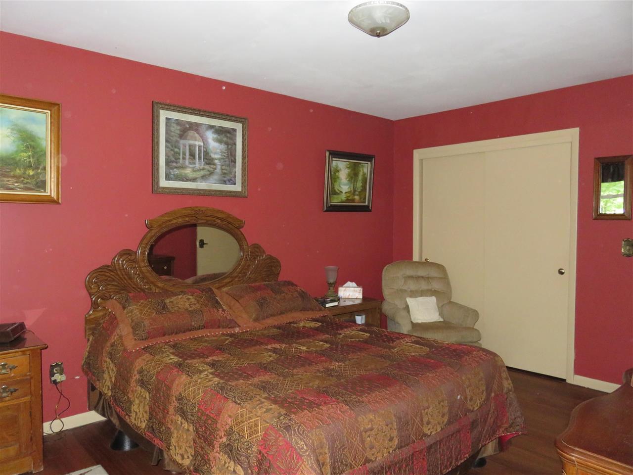 8766 Lovesee Road Roscoe, IL 61073 - Photo 24 of 27 a bedroom with a bed and a window