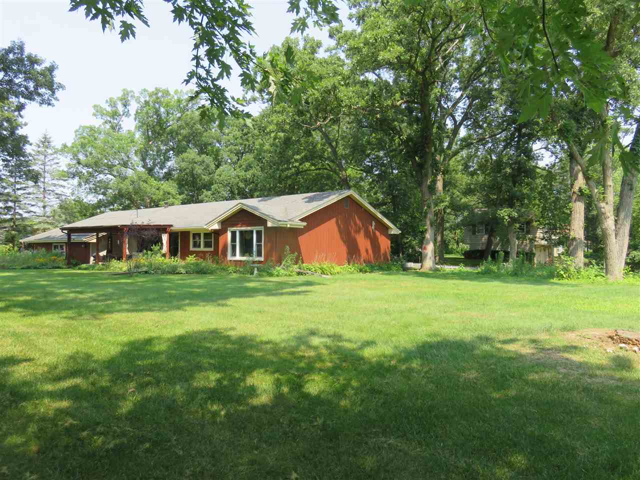8766 Lovesee Road Roscoe, IL 61073 - Photo 3 of 27 a front view of a house with garden