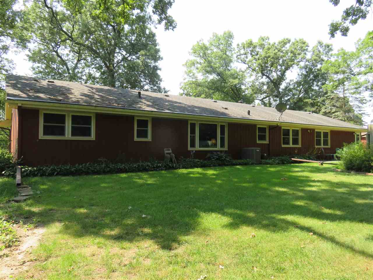 8766 Lovesee Road Roscoe, IL 61073 - Photo 4 of 27 a view of an house that has garden