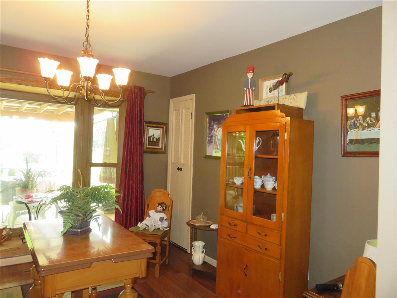 8766 Lovesee Road Roscoe, IL 61073 - Photo 9 of 27 a view of a dining room with furniture window and wooden floor