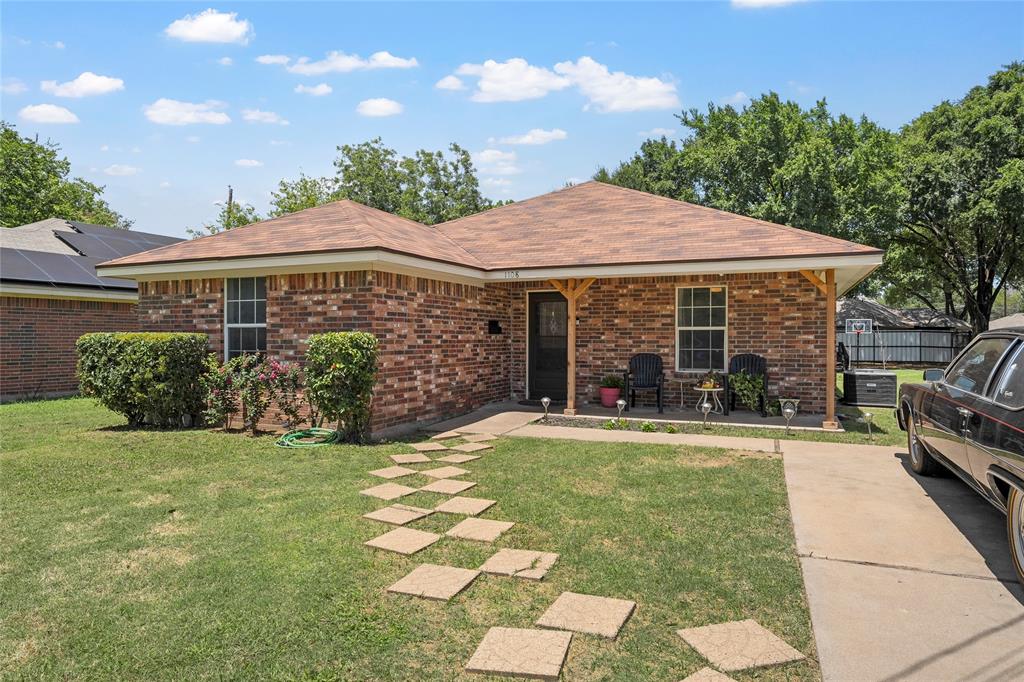 1108 Spring Street Waco, TX 76704 - Photo 2 of 17 a view of a house with a yard