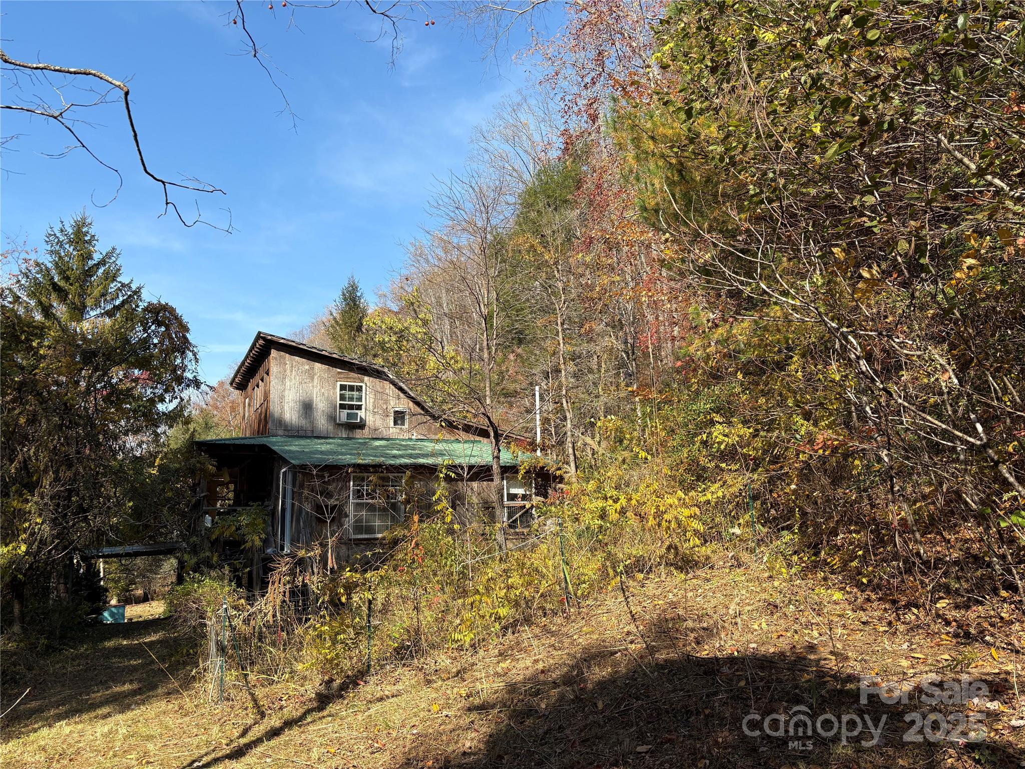 276 Cedar Creek Road Old Fort, NC 28762 - Photo 5 of 20 a backyard of a house with table and chairs
