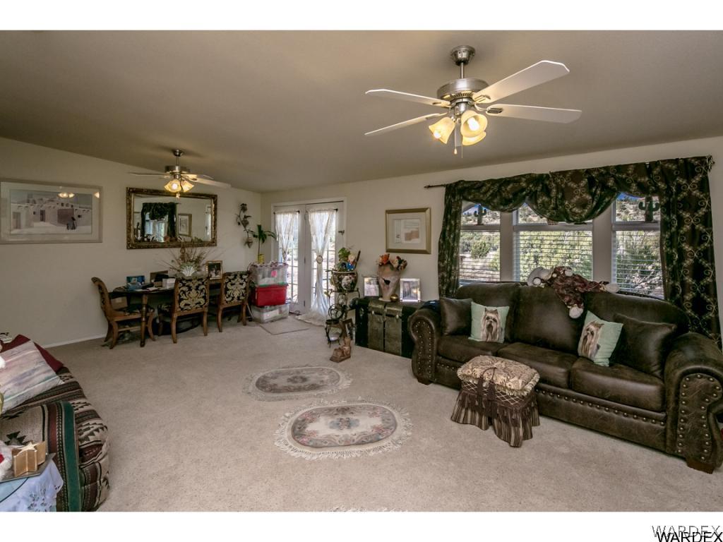 9701 East Blake Ranch Road Kingman, AZ 86401 - Photo 3 of 36 a living room with furniture and a large window