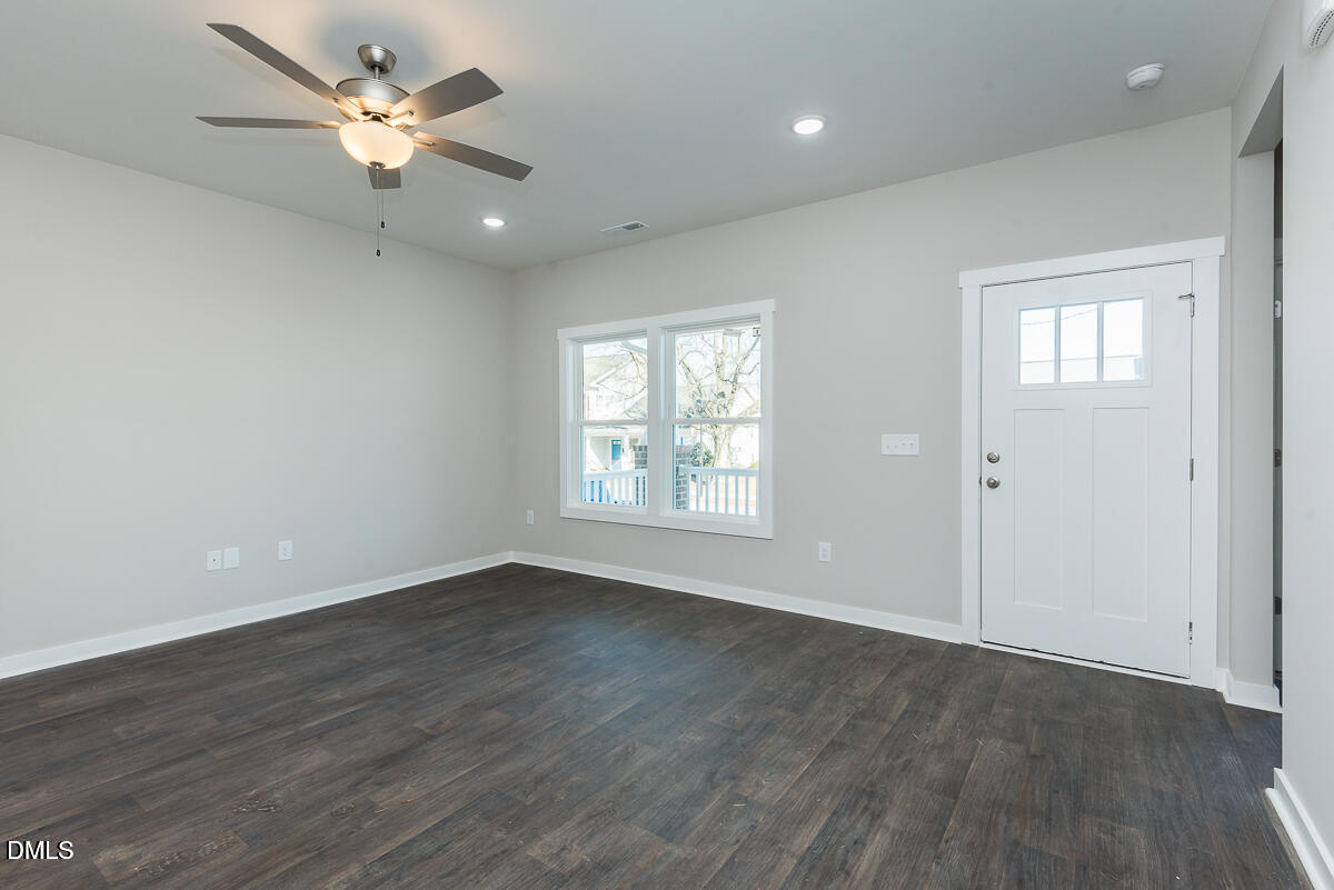 555 Pinnix Road Burlington, NC 27217 - Photo 3 of 20 wooden floor in an empty room with a window