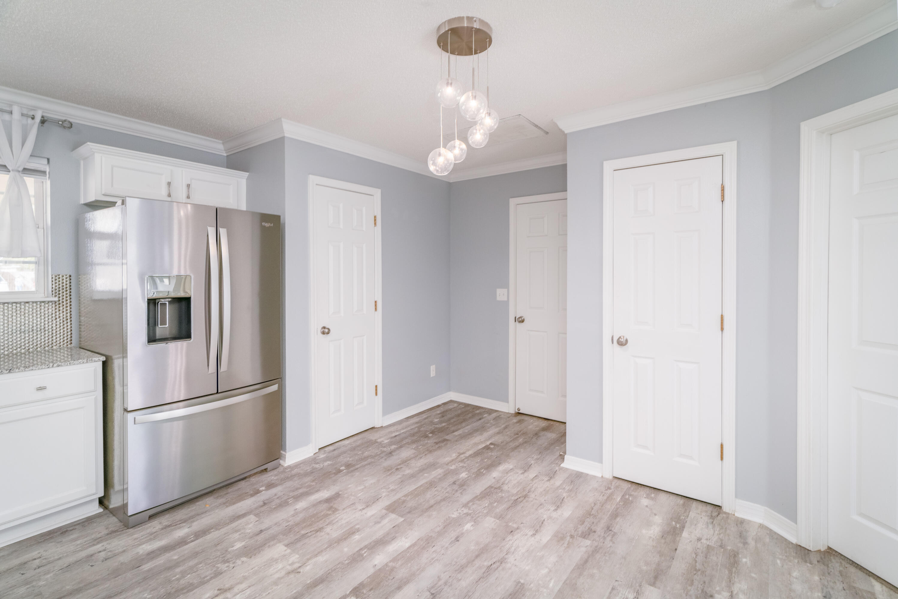 5191 Quince Avenue Crestview, FL 32539 - Photo 15 of 45 a view of a kitchen with a sink and refrigerator