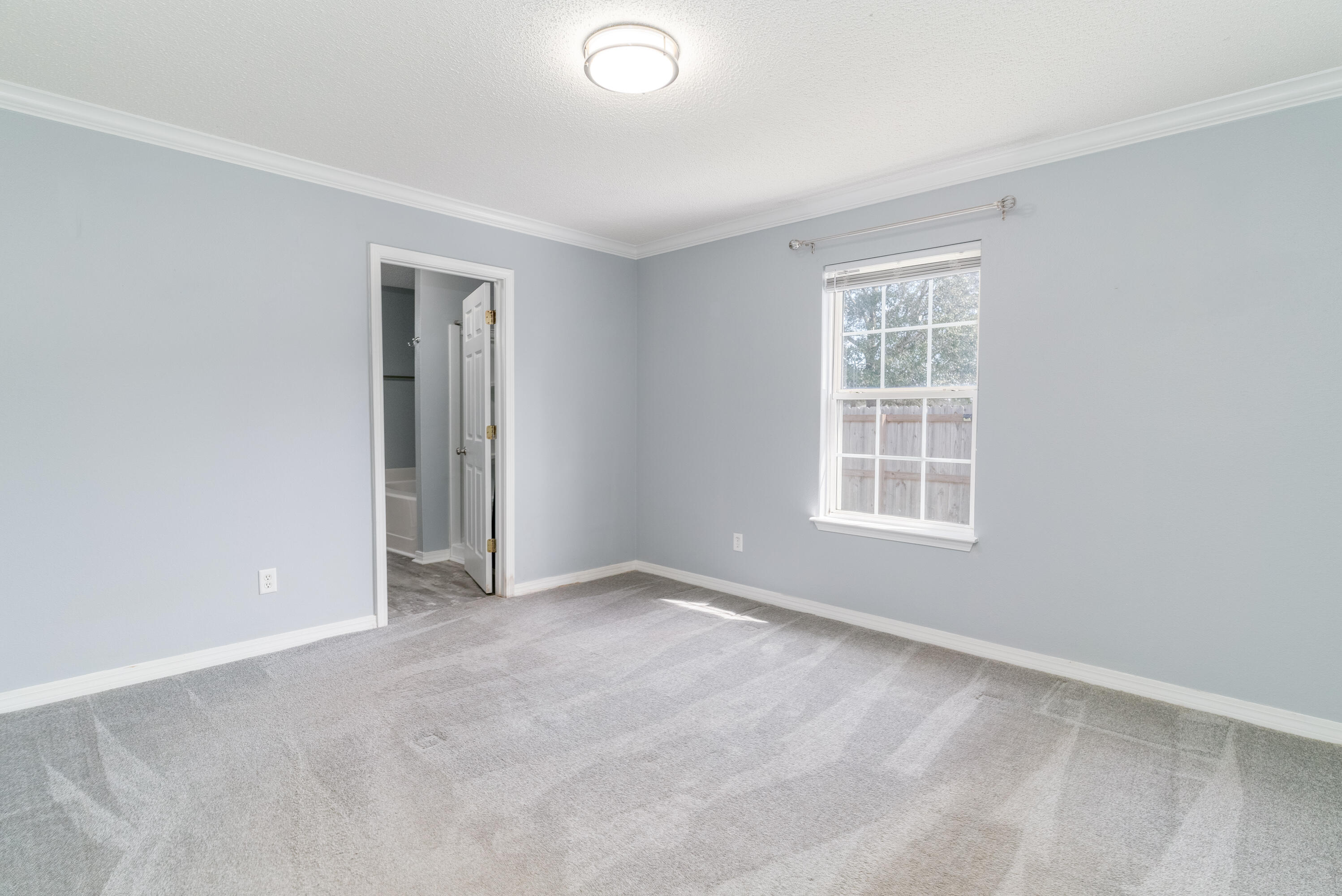 5191 Quince Avenue Crestview, FL 32539 - Photo 16 of 45 an empty room with windows
