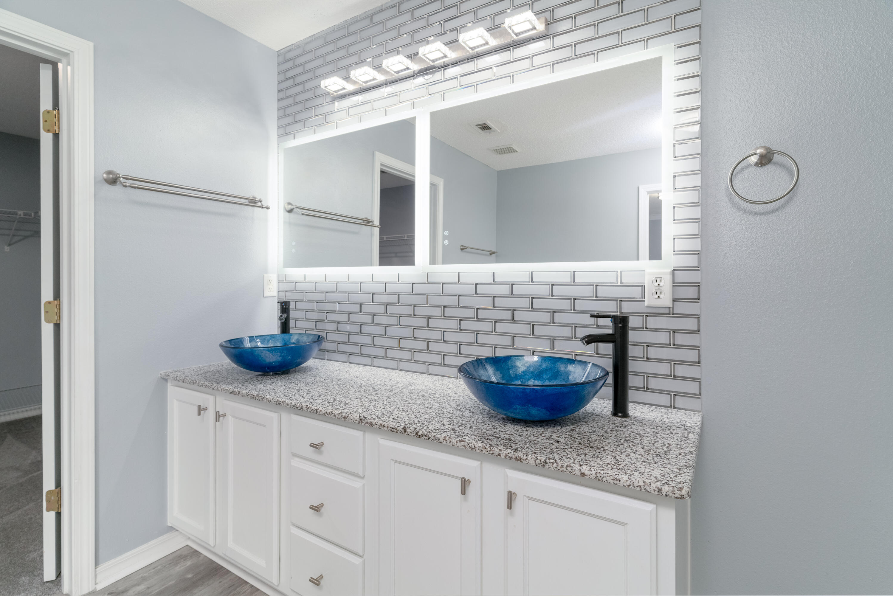 5191 Quince Avenue Crestview, FL 32539 - Photo 20 of 45 a bathroom with a granite countertop sink a toilet and a mirror