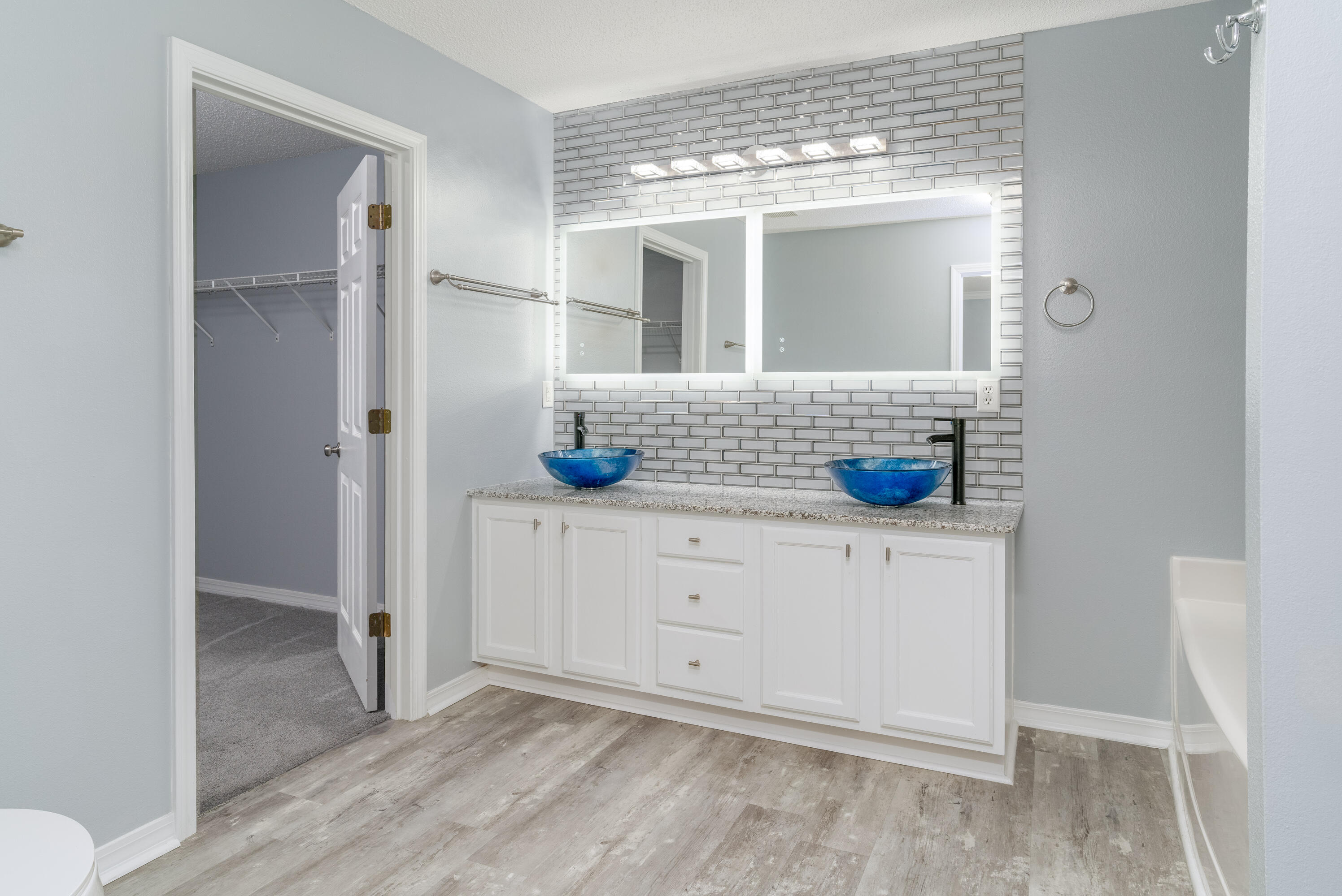 5191 Quince Avenue Crestview, FL 32539 - Photo 24 of 45 a view of bathroom with a sink a mirror and a shower