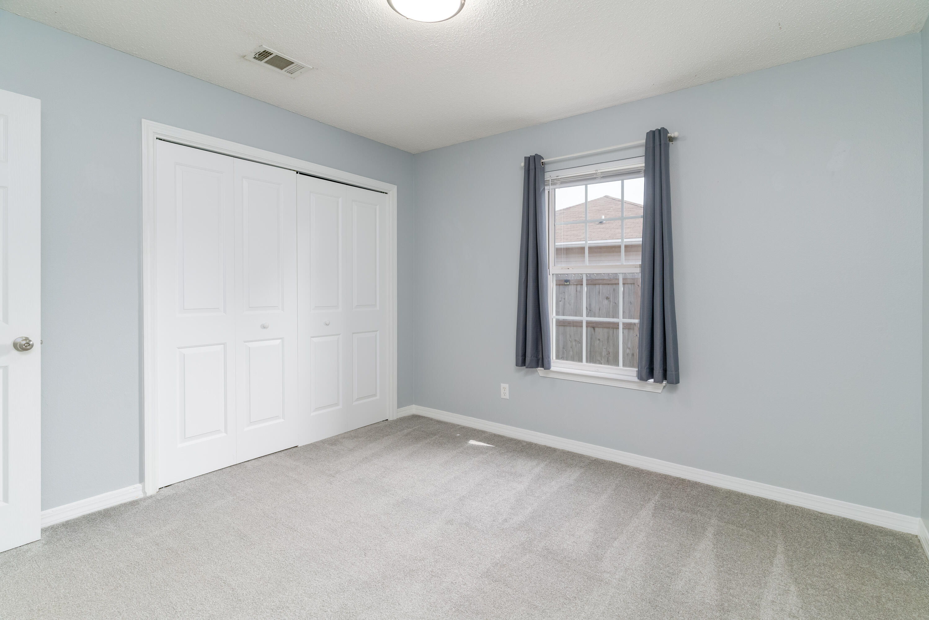 5191 Quince Avenue Crestview, FL 32539 - Photo 26 of 45 a view of an empty room with a window