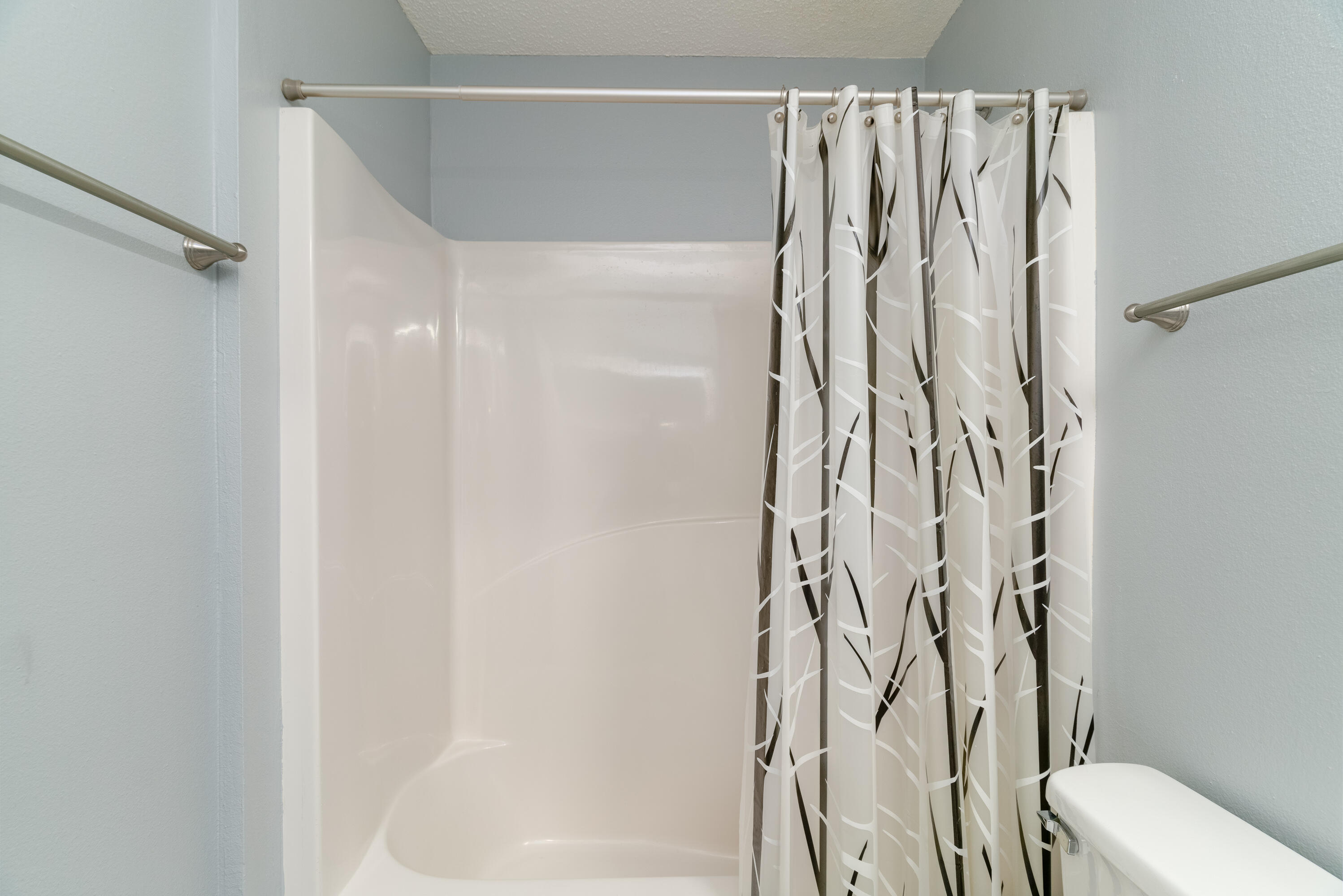 5191 Quince Avenue Crestview, FL 32539 - Photo 28 of 45 a bathroom with a shower curtain and a shower curtain