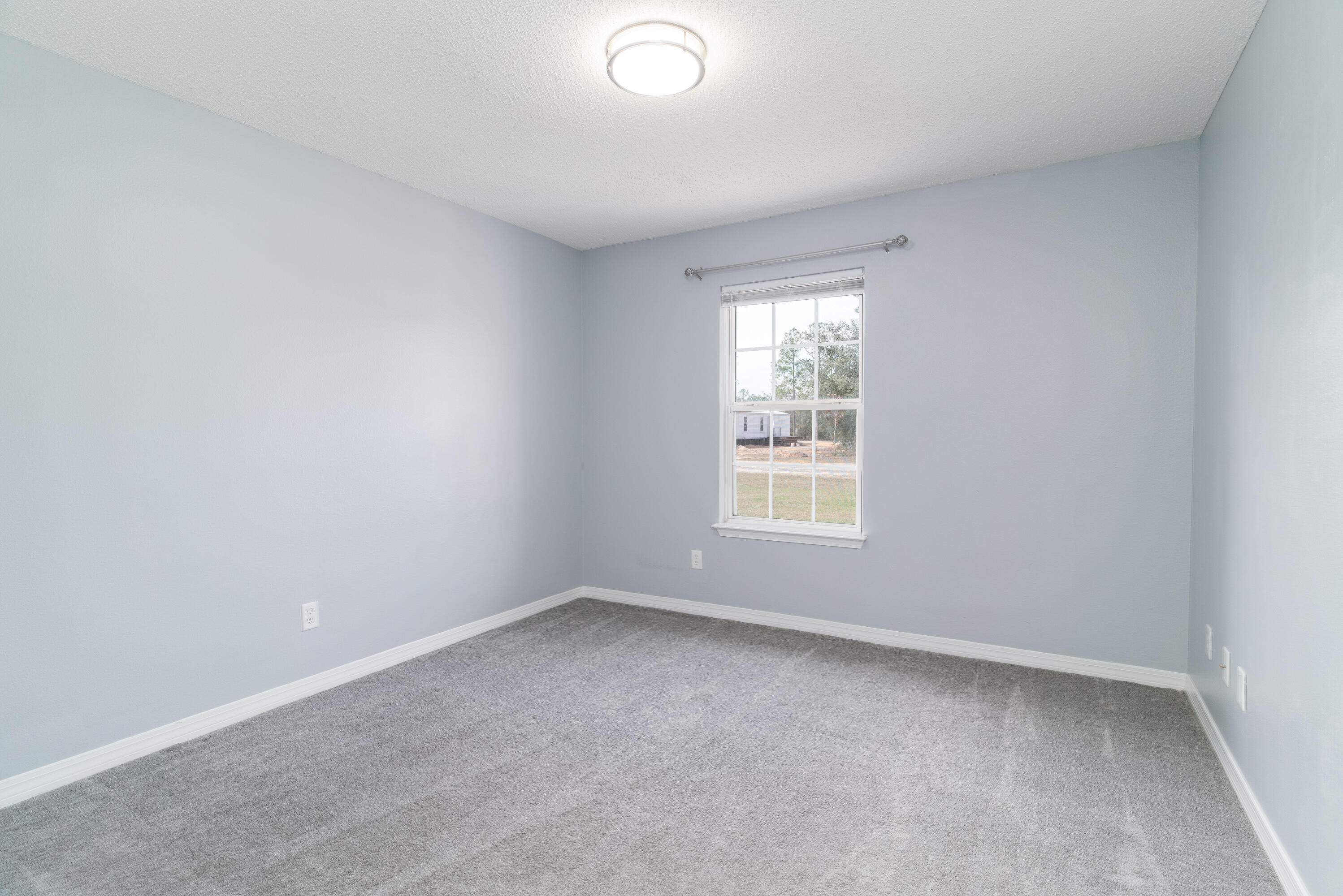 5191 Quince Avenue Crestview, FL 32539 - Photo 30 of 45 an empty room with a window