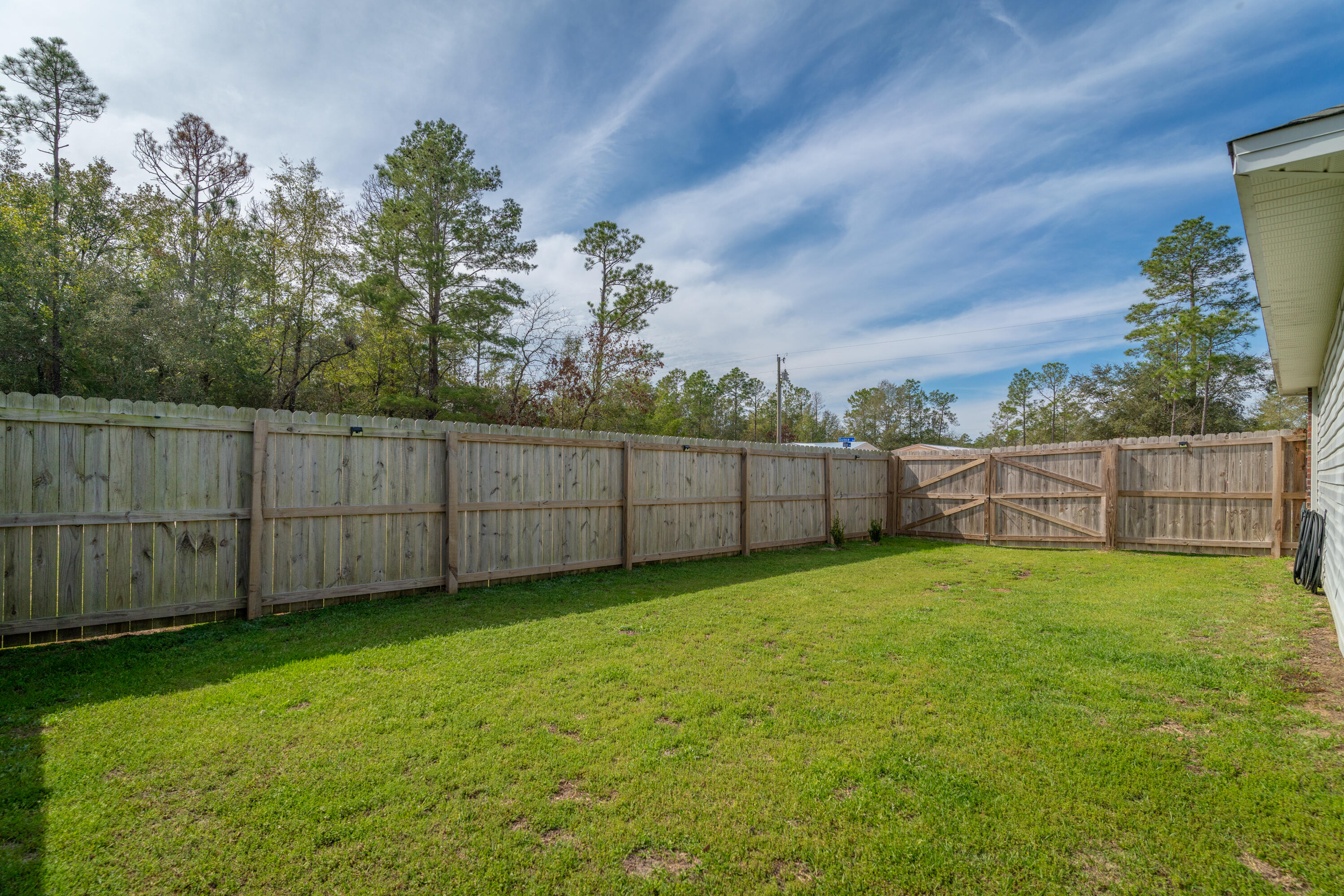 5191 Quince Avenue Crestview, FL 32539 - Photo 35 of 45 a view of a yard with wooden fence