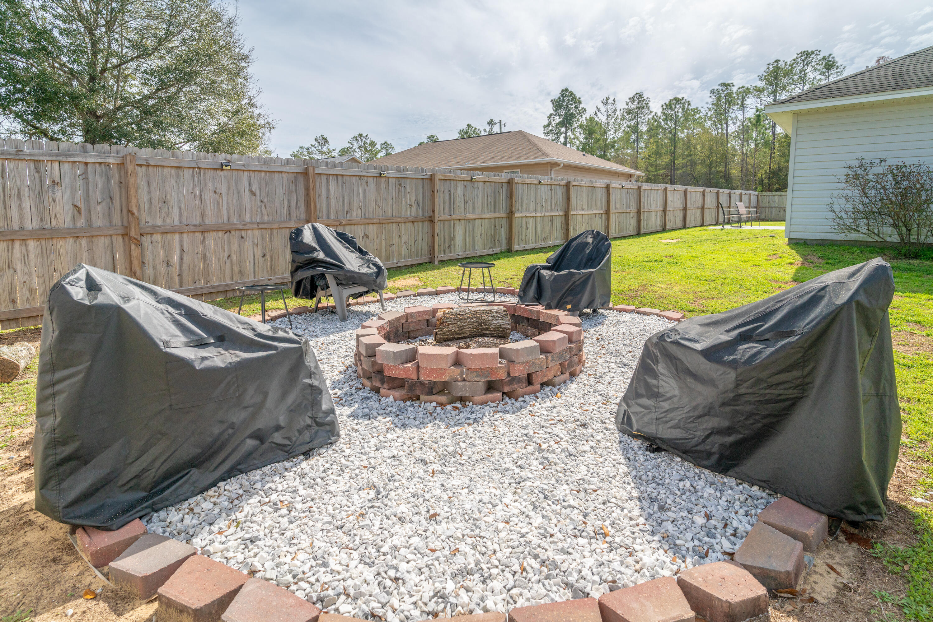 5191 Quince Avenue Crestview, FL 32539 - Photo 41 of 45 a view of a backyard with furniture and a garden