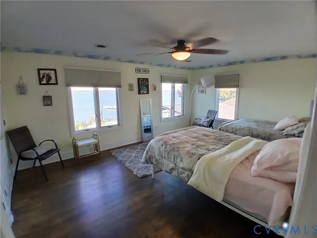 a spacious bedroom with a bed and windows