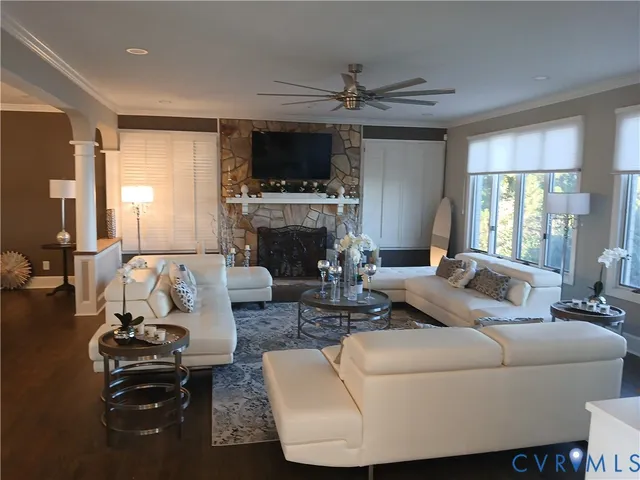 a living room with furniture and a fireplace