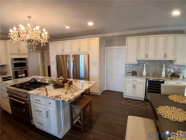 a kitchen with a sink stove and refrigerator