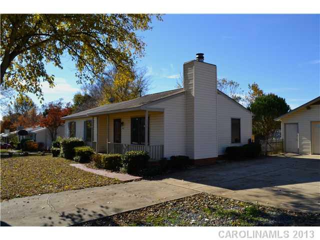 3417 Sandy Porter Road Charlotte, NC 28273 - Photo 2 of 12 a front view of house with yard and trees around
