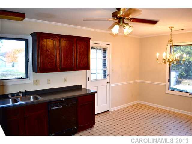 3417 Sandy Porter Road Charlotte, NC 28273 - Photo 7 of 12 a kitchen with a sink and cabinets