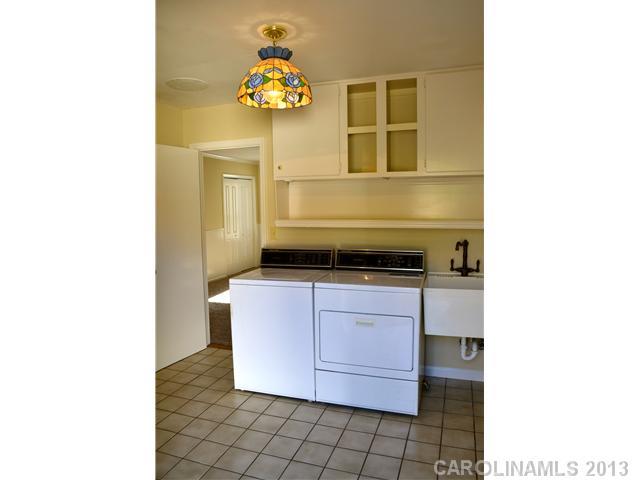 3417 Sandy Porter Road Charlotte, NC 28273 - Photo 9 of 12 a bathroom with a sink and a mirror
