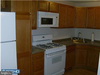987 Grant Road Folcroft, PA 19032 - Photo 4 of 12 a kitchen with a stove and a microwave
