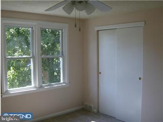 987 Grant Road Folcroft, PA 19032 - Photo 7 of 12 a view of an empty room with a window