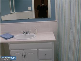 987 Grant Road Folcroft, PA 19032 - Photo 8 of 12 a bathroom with a sink and a mirror