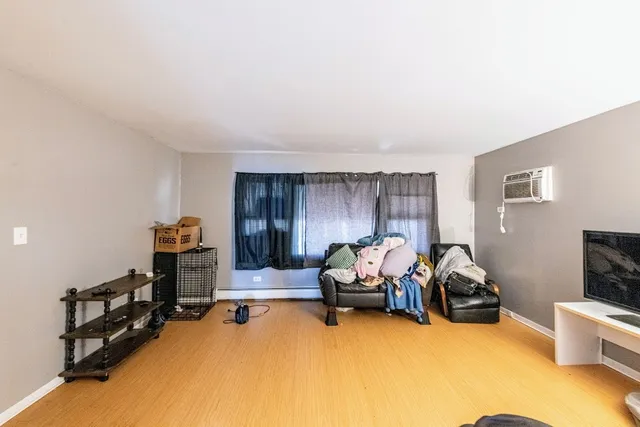 a view of a livingroom with workspace and a couch