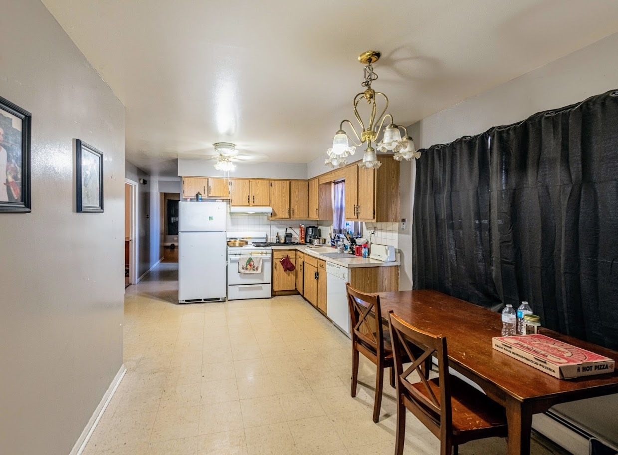 1619 35th Avenue Melrose Park, IL 60160 - Photo 12 of 35 a kitchen with refrigerator and cabinets