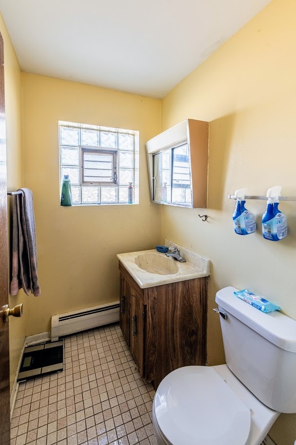 1619 35th Avenue Melrose Park, IL 60160 - Photo 17 of 35 a bathroom with a sink a toilet and a tub