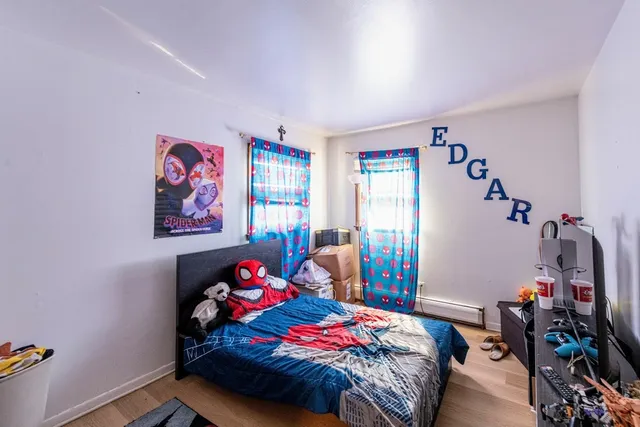 a bedroom with bed and a window